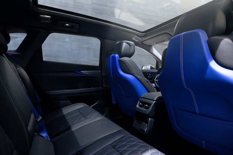 Back Seat View of the 2026 OPTIQ-V Blue Front Seats, Sun Roof, and Interior | Hansen Motor Co Cadillac in Brigham City UT